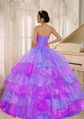 Ruffled Layers and Appliques Decorate Up Bodice Quinceanera Dress