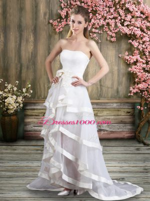 Sleeveless Tulle Sweep Train Backless Wedding Gowns in White with Ruffled Layers and Belt