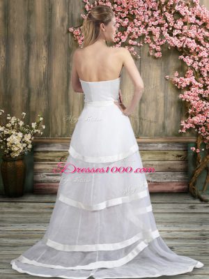 Sleeveless Tulle Sweep Train Backless Wedding Gowns in White with Ruffled Layers and Belt