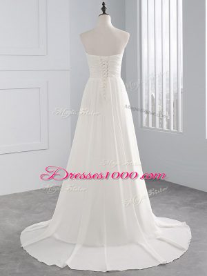 Chic White Sweetheart Lace Up Beading and Ruching Wedding Dress Brush Train Sleeveless