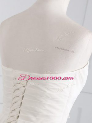 Chic White Sweetheart Lace Up Beading and Ruching Wedding Dress Brush Train Sleeveless