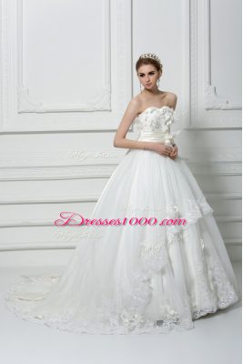 Captivating Sleeveless Tulle Brush Train Lace Up Bridal Gown in White with Lace and Appliques and Hand Made Flower