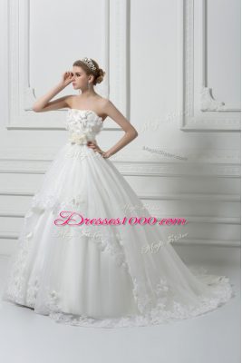 Captivating Sleeveless Tulle Brush Train Lace Up Bridal Gown in White with Lace and Appliques and Hand Made Flower