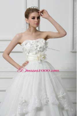 Captivating Sleeveless Tulle Brush Train Lace Up Bridal Gown in White with Lace and Appliques and Hand Made Flower