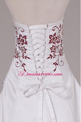 Satin Sleeveless Wedding Dresses Brush Train and Embroidery