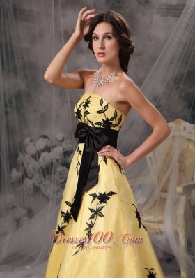 Yellow Prom Gowns with Black Applique and Sash