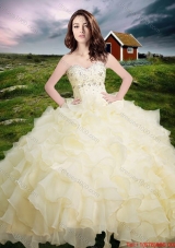 2017 Western Style Popular Organza Light Yellow Quinceanera Dress with Beading and Ruffled Layers